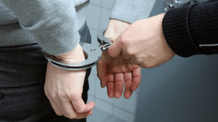 Person being put in handcuffs