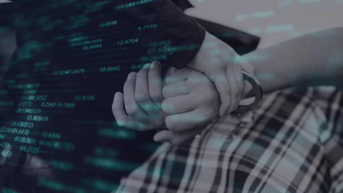 Person being arrested with data in front