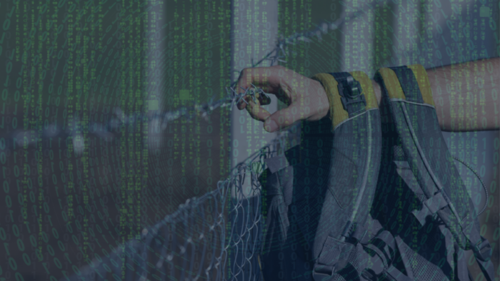 Person with backpack holding on to barbed wire fence with data superimposed in front